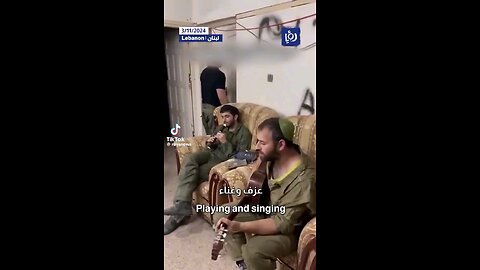 Israeli soldiers play & sing in a house in Lebanon after occupying it.