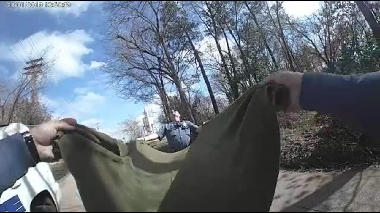 Bodycam shows police using blanket to catch kitten falling from tree