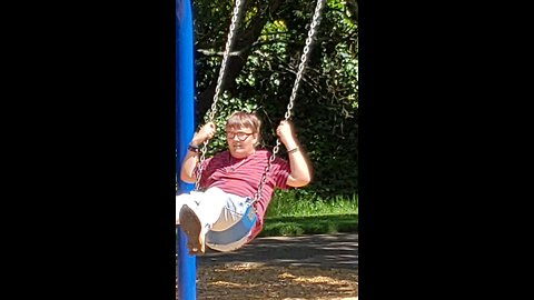 Autistic son enjoying swinging