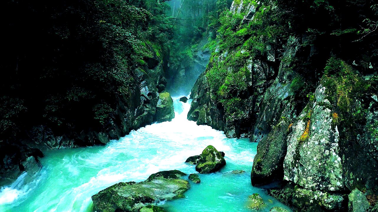 The Effortless cascade streams mysteriously spouting over the stones