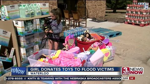 Girl Donates toys to flood victims