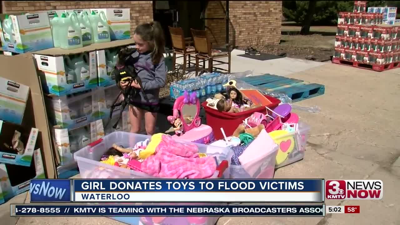 Girl Donates toys to flood victims