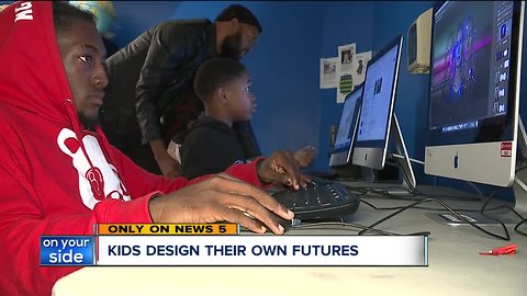 Volunteer teaches youth how to create content at Boys and Girls Club