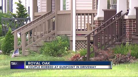 Royal Oak couple robbed at gunpoint in their driveway