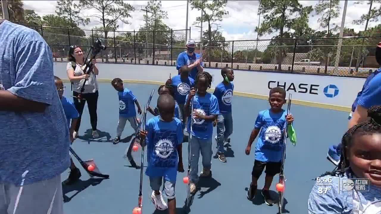 Kids make signs to hang on glass before Lightning playoff game