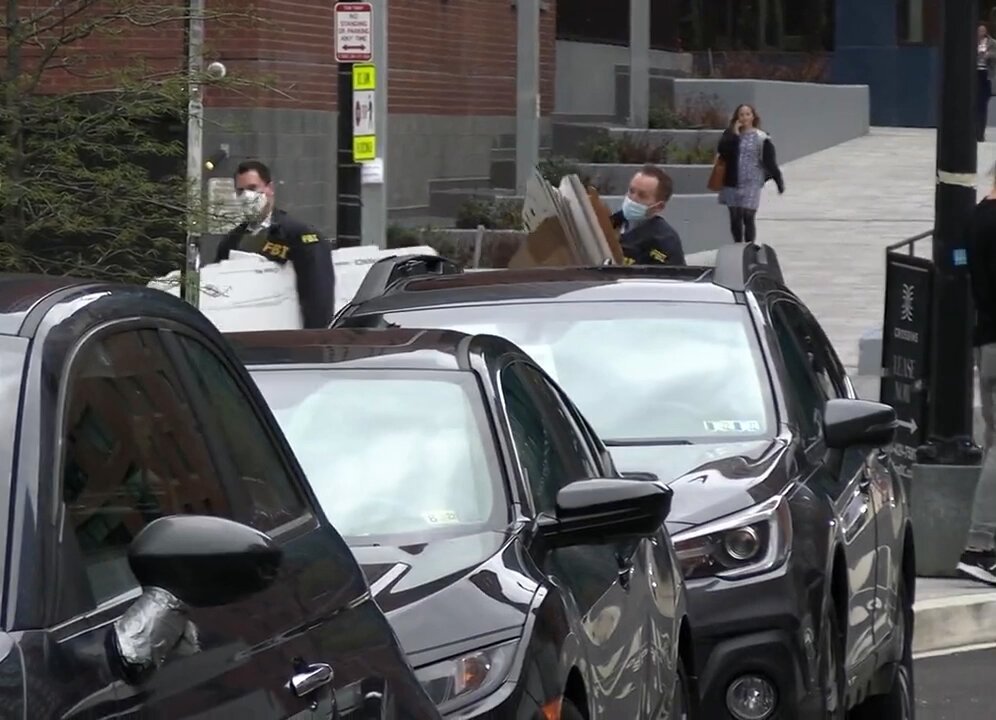 Federal Bureau of Investigation bring in boxes to collect evidence at the Crossing in Washington DC