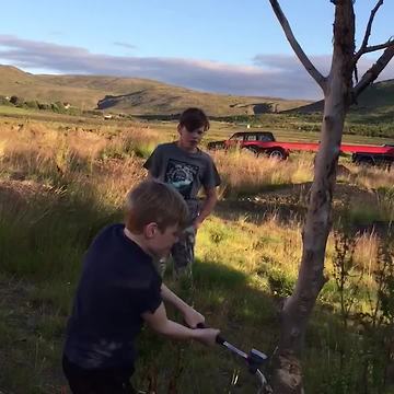 Kid Chops Tree and It Crashes Right Into Camera