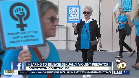 Community members gather to protest rapist's release