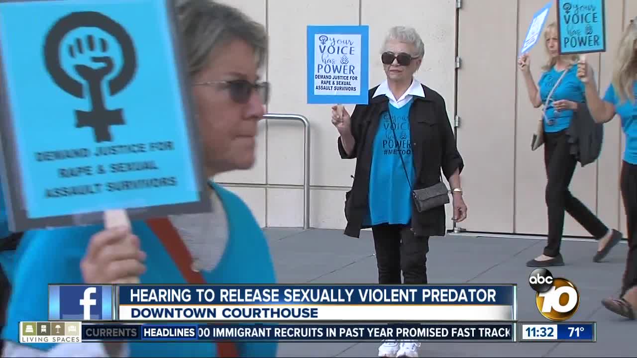 Community members gather to protest rapist's release