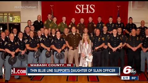 Daughter of slain Indiana trooper graduates surrounded by 39 of her father's 'brothers in blue'