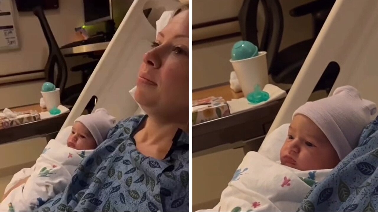 Newborn Baby Watches Tv With Mom