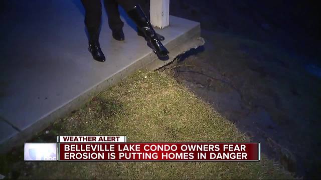 Belleville condo complex hovering on edge of a lake as the ground is washed away