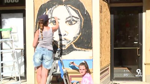 Boards covering broken windows bear new meaning after protests