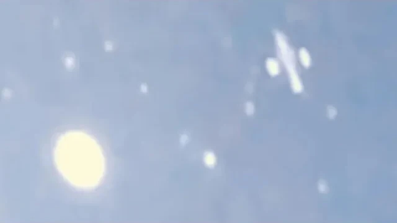 Passenger Jet Dwarfed By Huge UFO