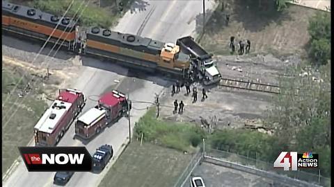 Train and dump truck collide tracks near i-435 and Missouri 210 highways