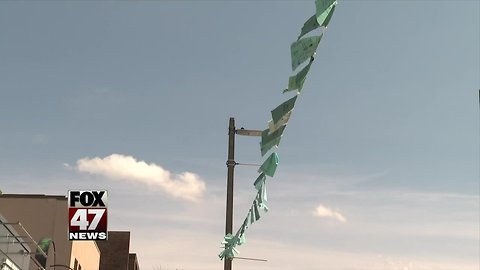 Dedicating the teal flags of East Lansing