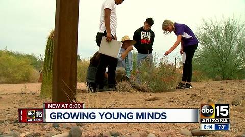 Science teacher bringing lessons to students outside of the classroom through garden