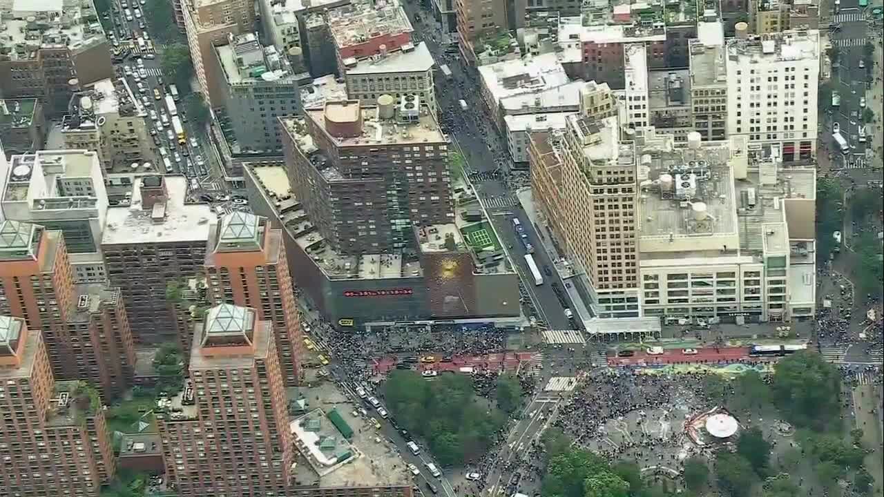 Crowd overwhelms New York City's Union Square, tosses chairs, climbs on vehicles