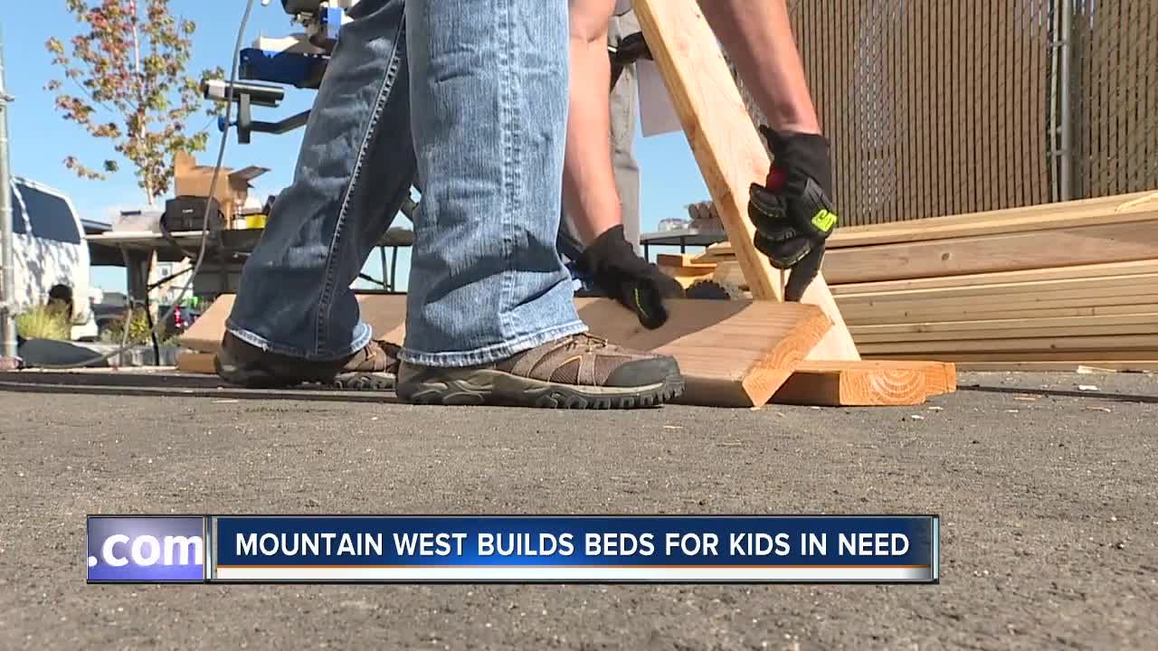 Bankers build bunk beds for kids in need