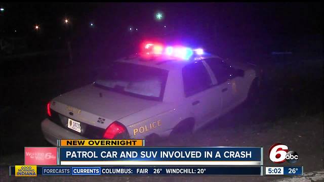 IMPD cruiser, Ford SUV crash into ditch after hitting slick spot in road