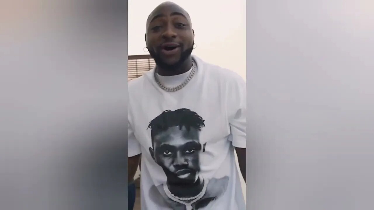 Watch the moment Davido sprays money randomly for his fans