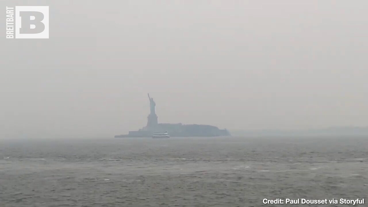 A LONELY FIGURE — Statue of Liberty Shrouded in Wildfire Smoke