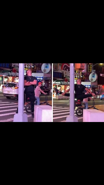 Talented performer hangs from rope by his mouth