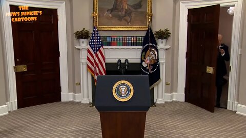 Biden pretends to wear his mask before entering the room.