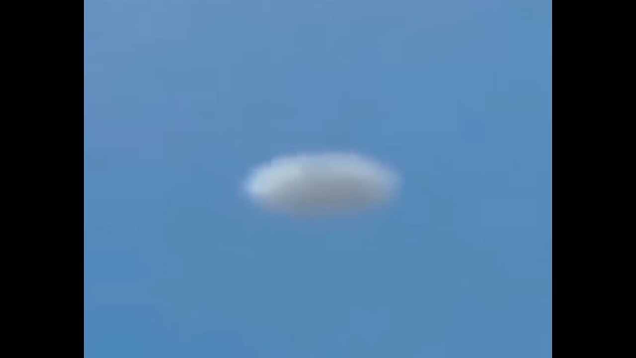 White Disc UFO Filmed from Plane over Denver