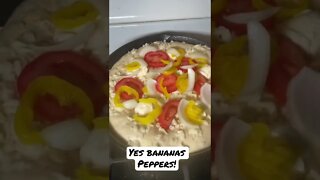 Stovetop deep dish. White pie with tomato, banana peppers, and onion.