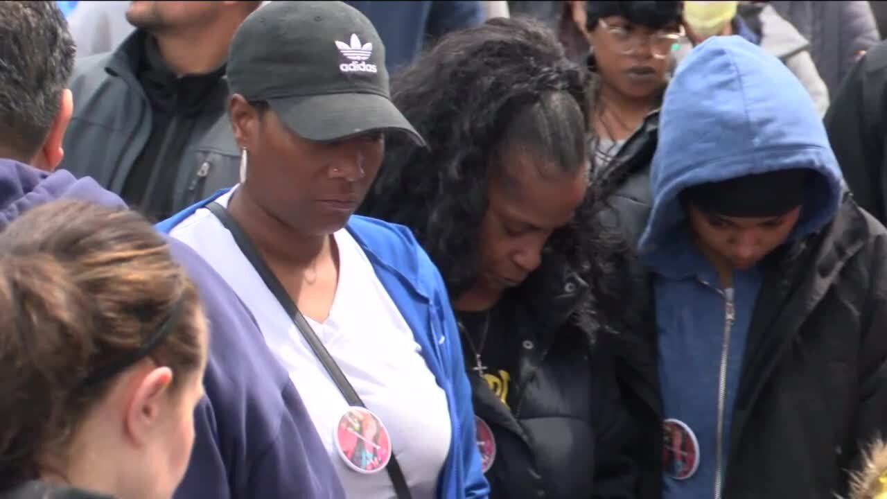 Residents, police hold walk to repair relations, prevent gun violence