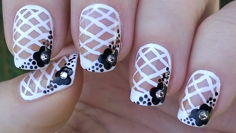 White net nail art with black flower