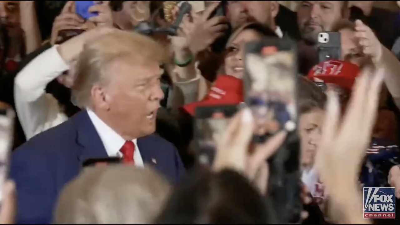 Trump introduced as "The next president of the United States" as he enters the room at Mar-a-Lago