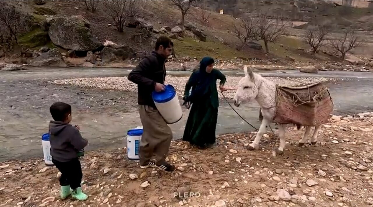 Life in the Nomads : Bringing water from the river by the nomadic woman