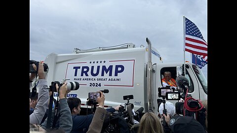 Donald Trump addresses the media while sitting in a garbage truck.