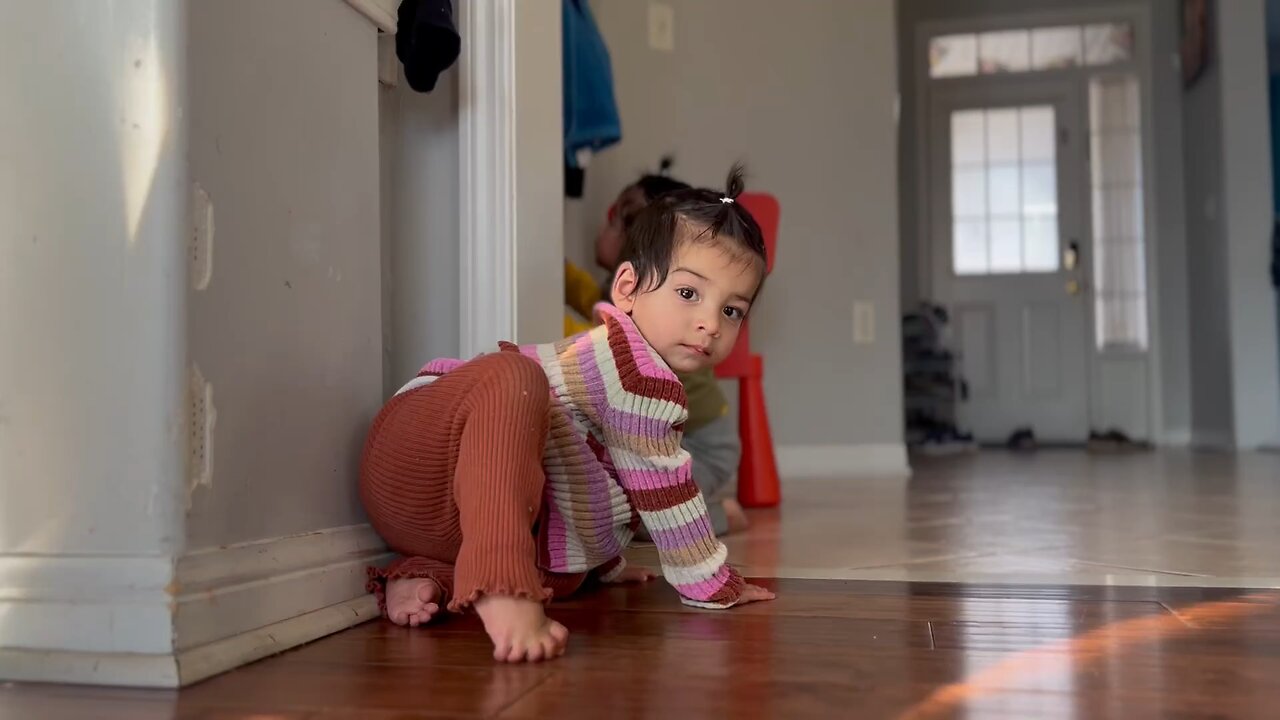 A child is sitting on the floor