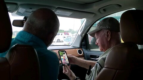 Son & Dad Enjoying Time Together Watching A Funny Reel