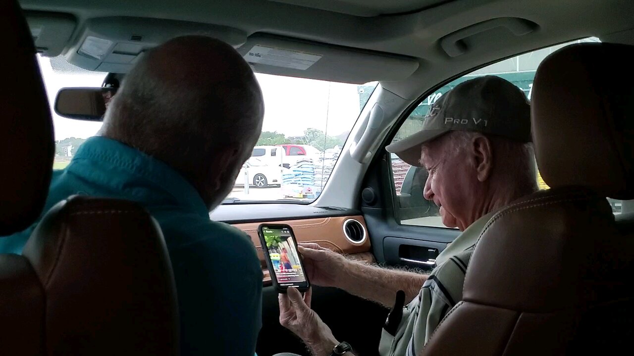 Son & Dad Enjoying Time Together Watching A Funny Reel