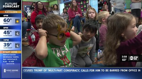 Santa's Drill Team meets children before the big day