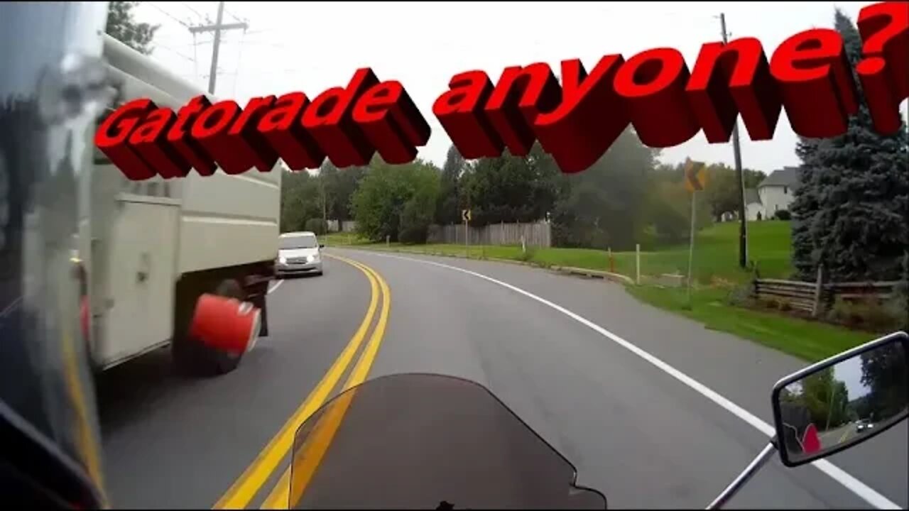 MOTOVLOG: Motorcycle close call with falling cooler, hits a car instead. Close call with SUV