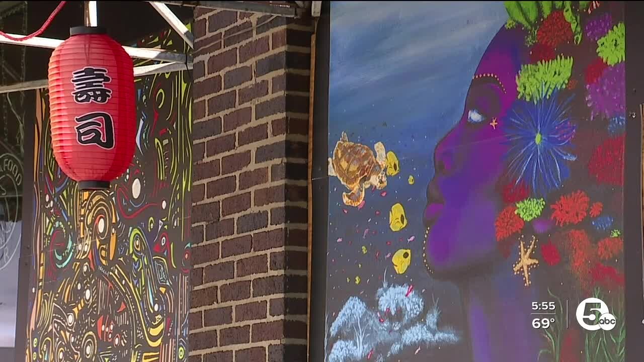 Artists create murals to cover vandalism caused during Akron protests
