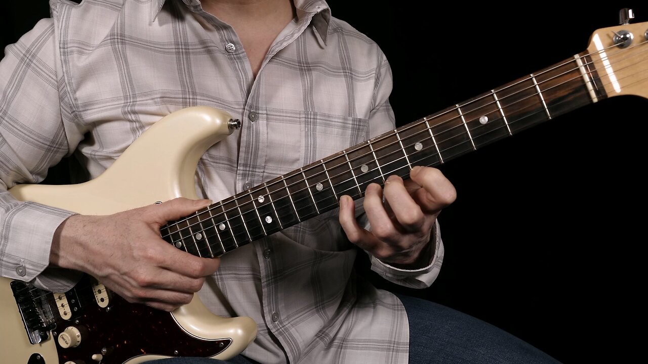 Fretting hand alignment for guitar