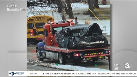 Collision between school bus and Cadillac at 58th and Blondo