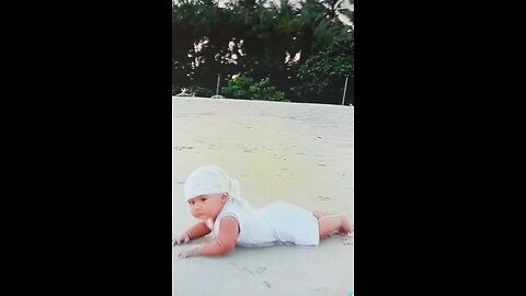 Little guy happy alone in beach