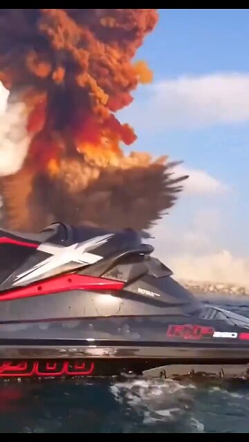 Jet ski rider dodges shockwave by jumping into water after explosion