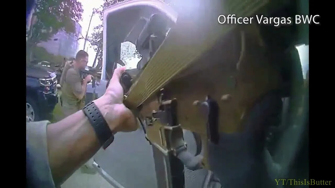 SWAT officer returns fire through the driver window after being shot at