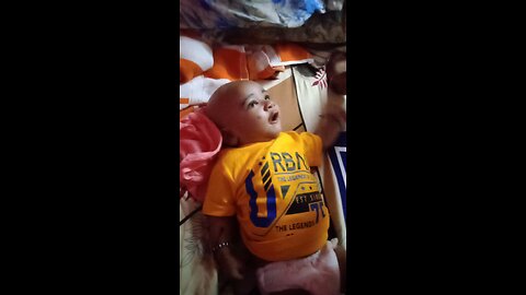 baby listening to her mom very carefully