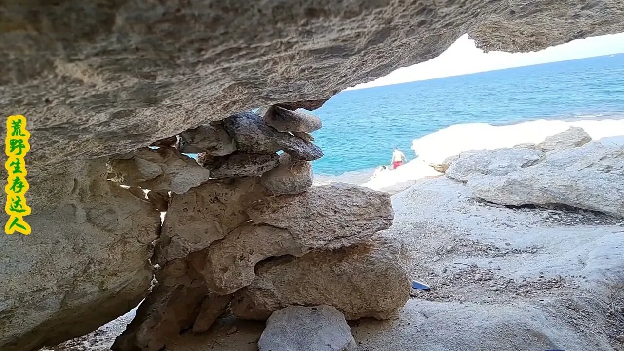 Camping on an island, using rocks to build a solid stone house between the rocks. 07