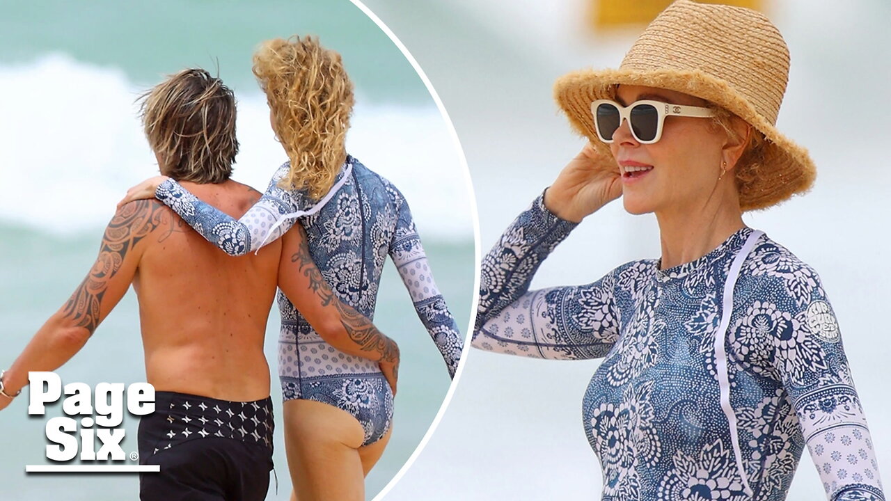 Loved-up Keith Urban and Nicole Kidman hit the beach in Sydney with daughter Faith