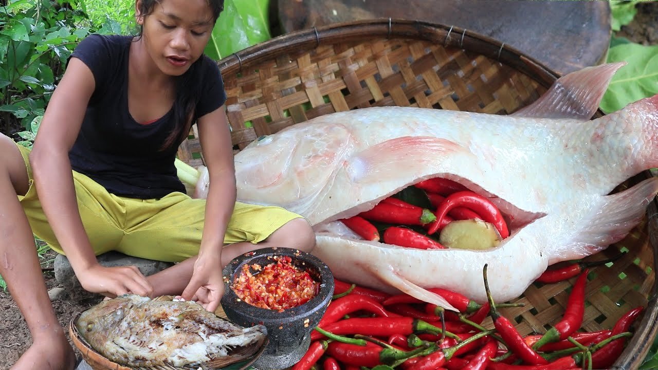 Yummy Red fish tasty with Chili sauce & Eating delicious in the jungle